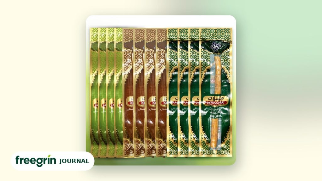 Freegrin miswak variety pack with original, clove and mint sticks on a cream background with the Freegrin Journal badge